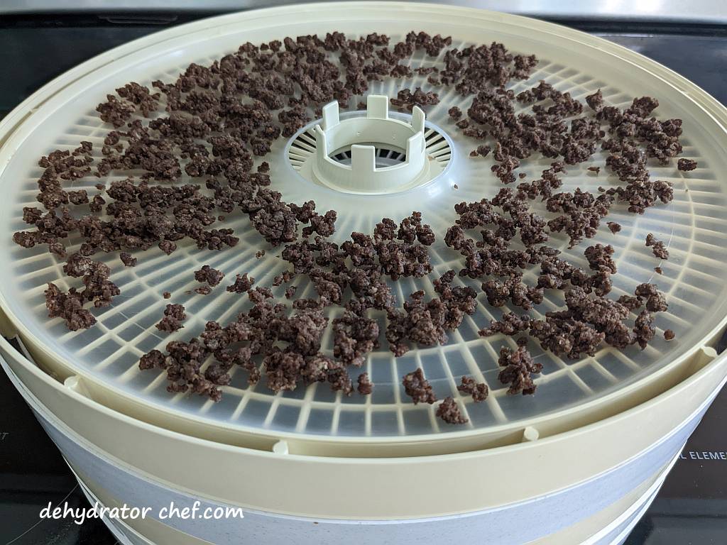 dehydrated ground beef on a dehydrator tray