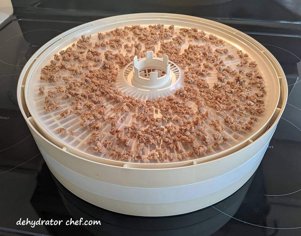 the dehydrated ground pork on a dehydrator tray