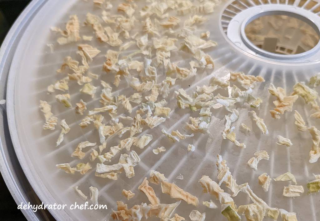 dehydrating onions on a fruit roll sheet | drying onions  | best foods to dehydrate for long term storage | dehydrating food for long term storage | dehydrated food recipes for long term storage | dehydrating meals for long term storage | food dehydrator for long term storage