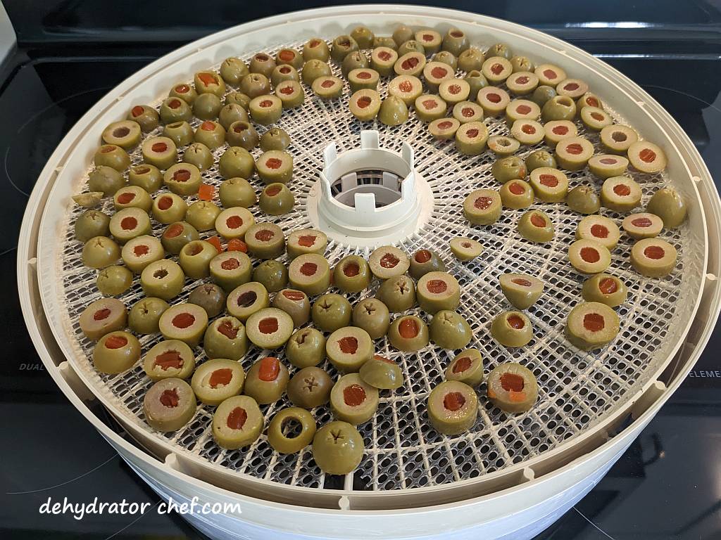 today we are dehydrating olives and here we have queen olives on a dehydrator tray