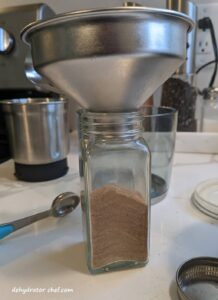 spice jar containing dehydrated beef stock turned into a beef bouillion powder