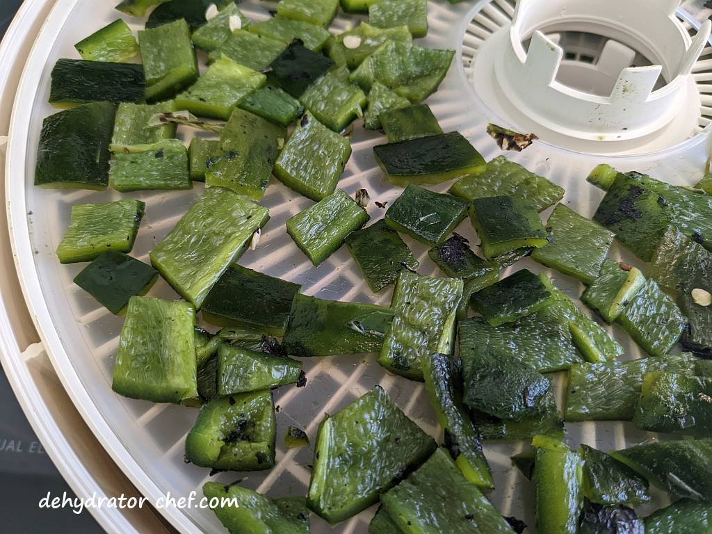 closeup of poblano peppers on a dehydrator tray | dehydrate poblano peppers
