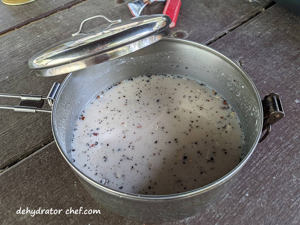 gravy mix ingredients hydrating in my cooking pot | make your own dehydrated meals | making dehydrated meals for camping | homemade dehydrated meal recipes | make your own dehydrated camping food | homemade dehydrated camping meals | homemade dehydrated backpacking meals