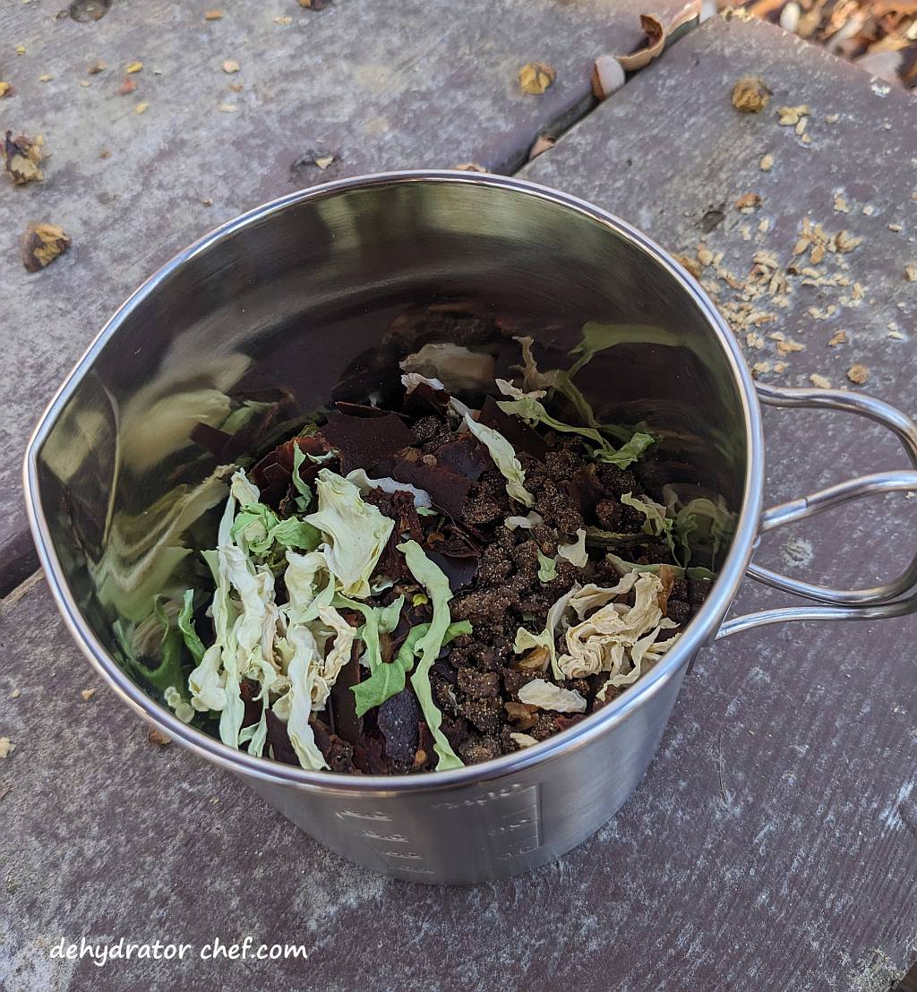 Shown are the unstuffed cabbage roll dry mix ingredients that were emptied into our cooking pot, which is step one. | Dehydrated unstuffed cabbage rolls. | Making dehydrated meals for camping. | Homemade dehydrated meal recipes. | Make your own dehydrated camping food | Homemade dehydrated camping meals. | Homemade dehydrated backpacking meals.