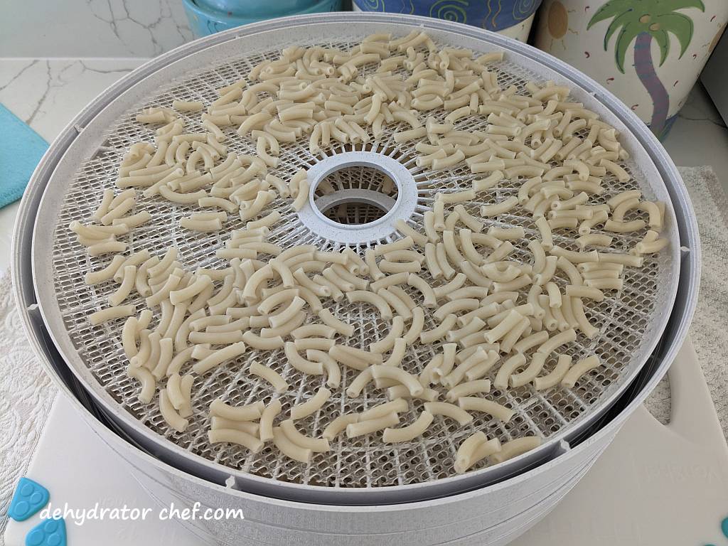 cooked macaroni on a dehydrator tray | | best foods to dehydrate for long term storage | dehydrating food for long term storage | dehydrated food recipes for long term storage | dehydrating meals for long term storage | food dehydrator for long term storage