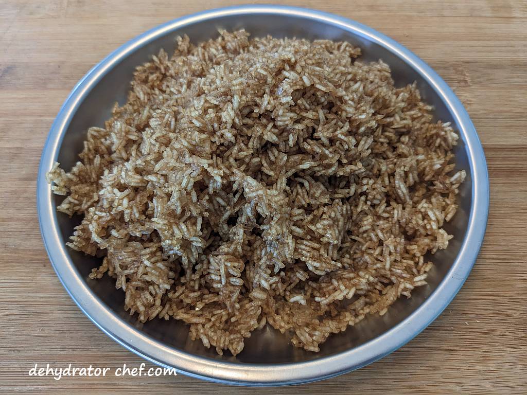 dehydrated white rice on a metal camping plate | | dehydrating white rice | dehydrated white rice | best foods to dehydrate for long term storage | dehydrating food for long term storage | dehydrated food recipes for long term storage | dehydrating meals for long term storage | food dehydrator for long term storage