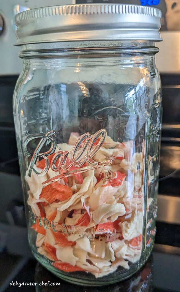 dried imitation crab meat in a canning jar | dehydrated imitation crab meat | dehydrating imitation crab meat | how to dehydrate imitation crab meat | best foods to dehydrate for long term storage | dehydrating food for long term storage | dehydrated food recipes for long term storage | dehydrating meals for long term storage | food dehydrator for long term storage | making dehydrated meals for camping | homemade dehydrated meal recipes | make your own dehydrated camping food | homemade dehydrated camping meals | homemade dehydrated backpacking meals