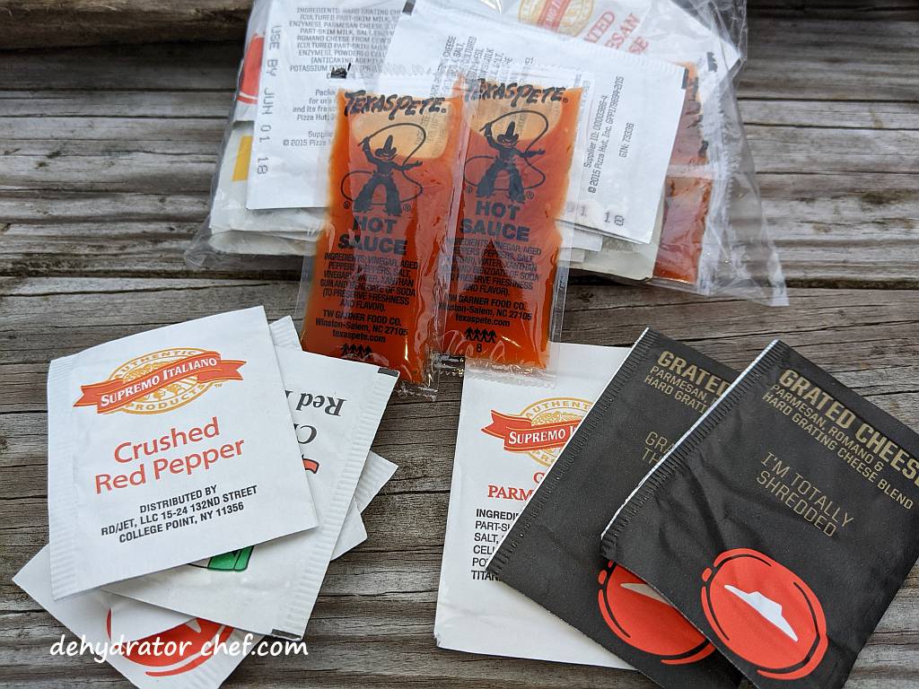 Shown is a collection of spice and hot sauce packet offerings from fast-food eateries used to enhance homemade camping food meals. | Dehydrated beef curry. | Making dehydrated meals for camping. | Homemade dehydrated meal recipes. | How to make your own dehydrated camping food. | Homemade dehydrated camping meals. | Homemade dehydrated backpacking meals.