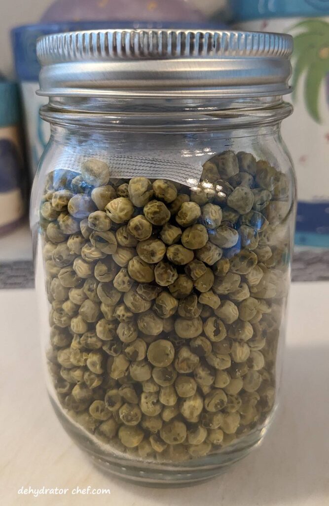 dried peas in a one pint canning jar for long term storage | dehydrating canned peas | dehydrated peas | best foods to dehydrate for long term storage | dehydrating food for long term storage | dehydrated food recipes for long term storage | dehydrating meals for long term storage | food dehydrator for long term storage