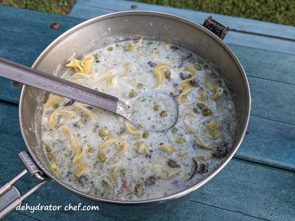 bringing the dehydrated beef stroganoff to a boil | dehydrated beef stroganoff | making dehydrated meals for camping | homemade dehydrated meal recipes | make your own dehydrated camping food | homemade dehydrated camping meals | homemade dehydrated backpacking meals