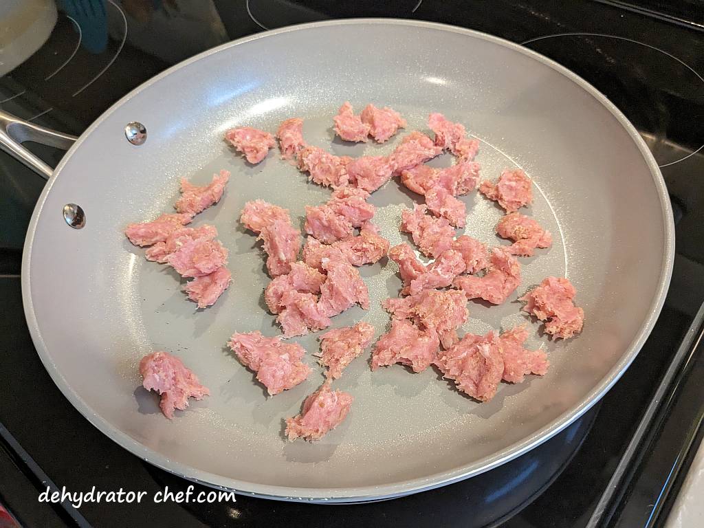 cooking ground pork in a non-stick pan | dehydrated ground pork | dehydrating ground pork | best foods to dehydrate for long term storage | dehydrating food for long term storage | dehydrated food recipes for long term storage | dehydrating meals for long term storage | food dehydrator for long term storage | making dehydrated meals for camping | homemade dehydrated meal recipes | make your own dehydrated camping food | homemade dehydrated camping meals | homemade dehydrated backpacking meals