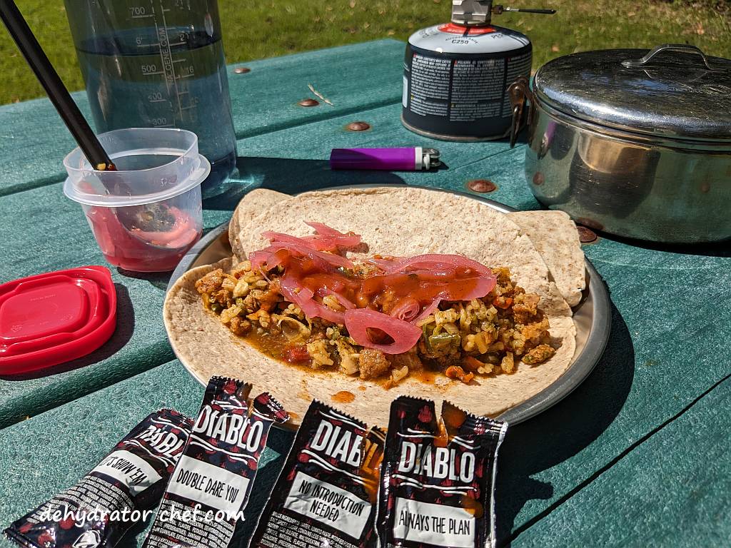 This pork tacos and Mexican rice recipe is fully cooked and a meal ready to eat. We've loaded up a couple of tortilla wraps and added some red pickled onions with a few packets of salsa. We're eating good tonight.