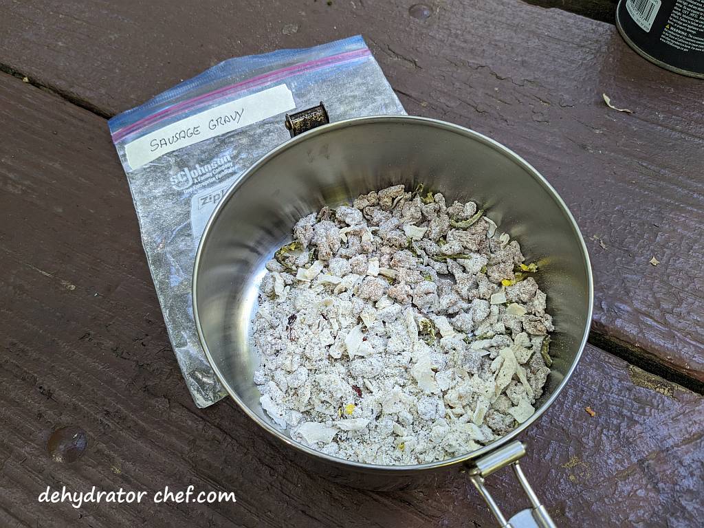 sausage gravy dry mix in a cooking pot | dehydrated sausage gravy in pita pocket bread | making dehydrated meals for camping | homemade dehydrated meal recipes | make your own dehydrated camping food | homemade dehydrated camping meals | homemade dehydrated backpacking meals