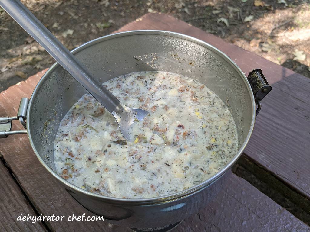 sausage gravy just starting to boil | dehydrated sausage gravy in pita pocket bread | making dehydrated meals for camping | homemade dehydrated meal recipes | make your own dehydrated camping food | homemade dehydrated camping meals | homemade dehydrated backpacking meals