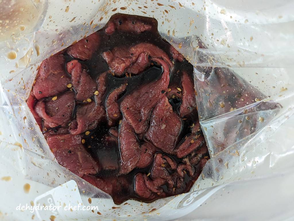 beef jerky marinating in a bag | how to make beef jerky | best foods to dehydrate for long term storage | dehydrating food for long term storage | dehydrated food recipes for long term storage | dehydrating meals for long term storage | food dehydrator for long term storage