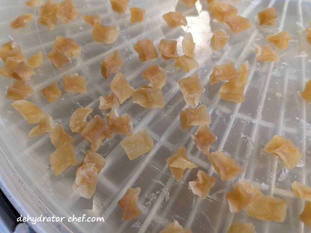 close up of diced potatoes on dehydrator tray | dehydrating potatoes | dehydrated diced potatoes | best foods to dehydrate for long term storage | dehydrating food for long term storage | dehydrated food recipes for long term storage | dehydrating meals for long term storage | food dehydrator for long term storage