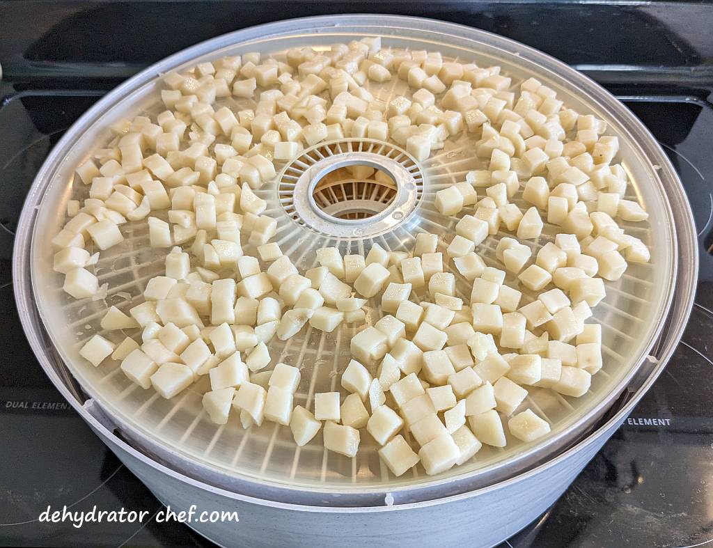 diced potatoes on dehydrator trays | dehydrating potatoes | dehydrated diced potatoes | best foods to dehydrate for long term storage | dehydrating food for long term storage | dehydrated food recipes for long term storage | dehydrating meals for long term storage | food dehydrator for long term storage