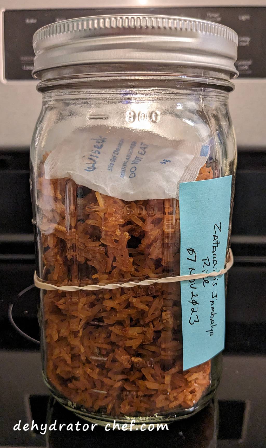 This is our dehydrated Zatarain's Jambalaya Rice mix, which includes a desiccant packet inside the canning jar to control moisture. The desiccant packet helps to absorb ambient humidity, extending the shelf life of our dehydrated camping food.