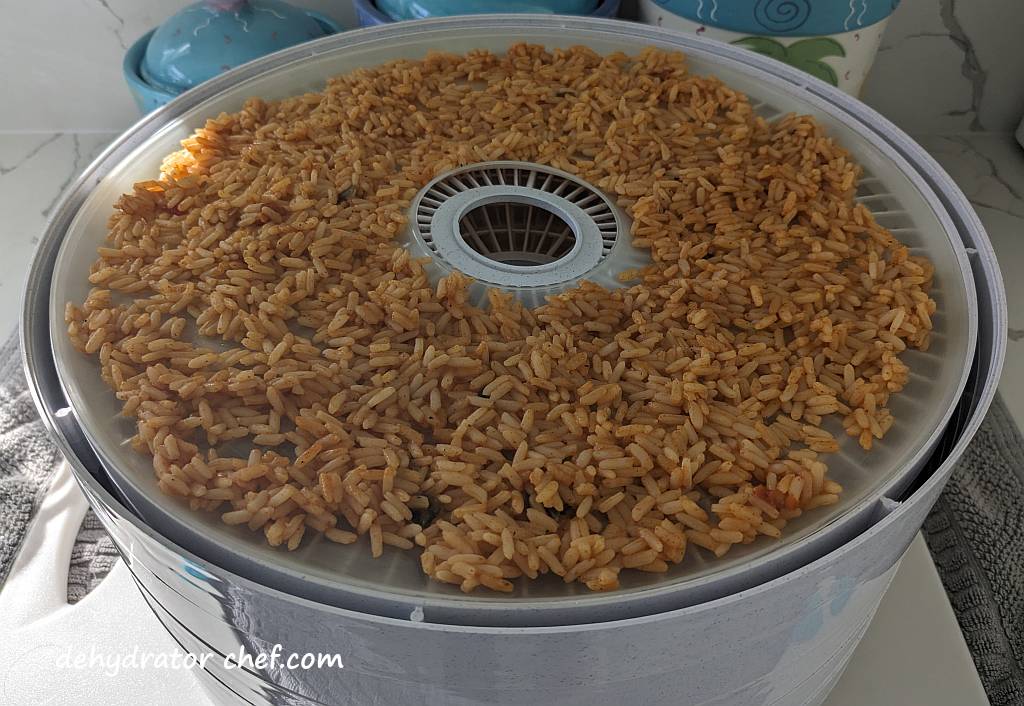 Zatarain's Jambalaya Rice on a dehydrator tray | dehydrating Zatarain's Jambalaya Rice | dehydrated Zatarain's Jambalaya Rice | best foods to dehydrate for long term storage | dehydrating food for long term storage | dehydrated food recipes for long term storage | dehydrating meals for long term storage | food dehydrator for long term storage