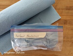 seafood jambalaya double wrapped with Scotts Shop towels for protection against compromise | | dehydrated seafood jambalaya recipe | making dehydrated meals for camping | homemade dehydrated meal recipes | make your own dehydrated camping food | homemade dehydrated camping meals | homemade dehydrated backpacking meals
