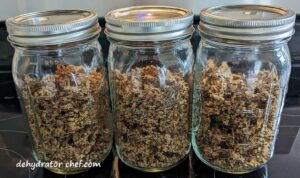 in step 5, equalizing and conditioning, the dehydrated quinoa in quart-sized canning jars | dehydrating quinoa | dehydrated quinoa | best foods to dehydrate for long term storage | dehydrating food for long term storage | dehydrated food recipes for long term storage | dehydrating meals for long term storage | food dehydrator for long term storage