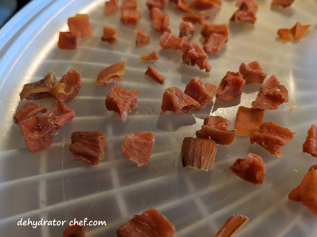 close up of dehydrated sweet potato cubes | dehydrating sweet potatoes | dehydrated sweet potatoes | how to dehydrate sweet potatoes | best foods to dehydrate for long term storage | dehydrating food for long term storage | dehydrated food recipes for long term storage | dehydrating meals for long term storage | food dehydrator for long term storage