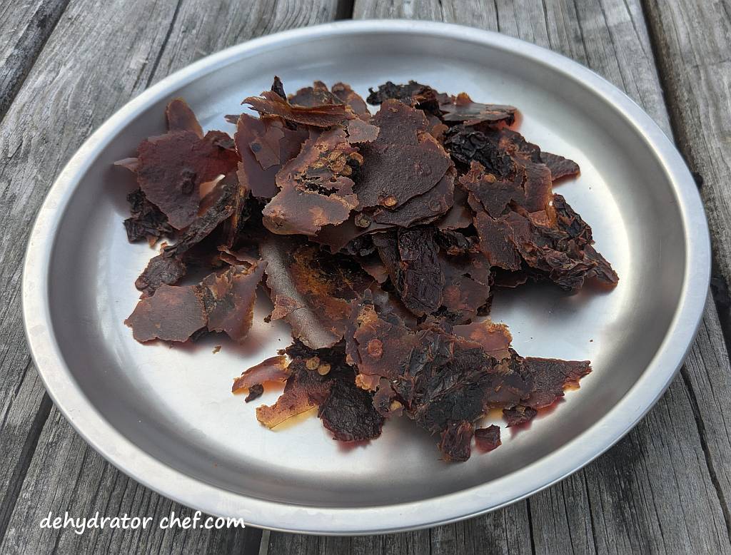 Sixty-five grams of dehydrated chipotle peppers in adobo sauce on a plate.