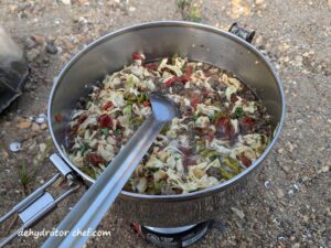 dehydrated ground beef and cabbage simmering on the backpacking stove for two minutes