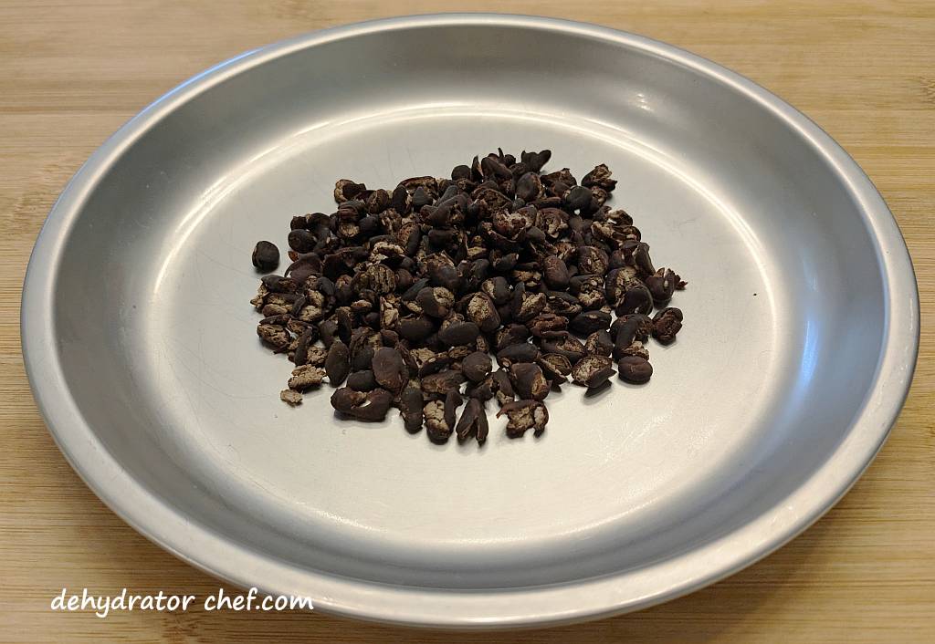 one serving of dehydrated black beans on a camping plate