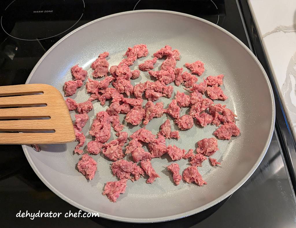 working in batches we are cooking the ground beef breadcrumb mix in a non-stick skillet