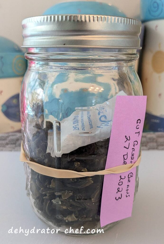 Dehydrated green beans in a canning jar for long-term pantry storage.