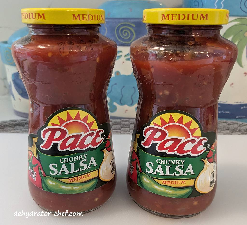 We are dehydrating these two jars of good-quality salsa. Salsa is one of the best foods to dehydrate for long-term storage since it can be used for so many things.