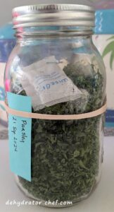 Dehydrated parsley in a 1-quart canning jar for long term storage in the pantry.