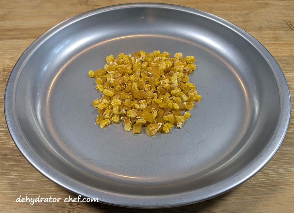 This is one 20-gram serving of dehydrated corn a plate.