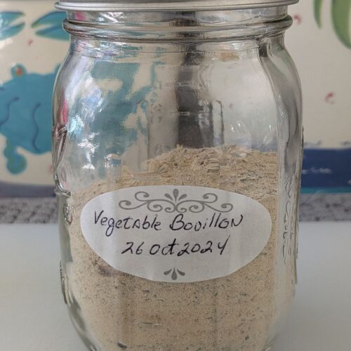 A supply of homemade vegetable bouillon powder in a 1-pint canning jar.