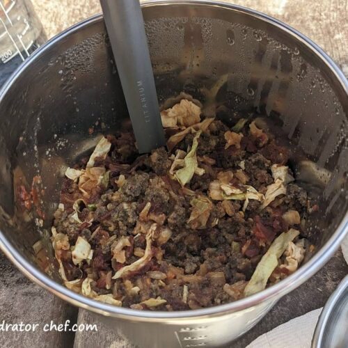 Shown is our dehydrated unstuffed cabbage roll recipe, a satisfying, lightweight meal on your next trip to the field or campsite. The ground beef crumbles, rice, and cabbage combined with the RoTel diced tomatoes with green chilies and tomato sauce provide a rich flavor. Spices like garlic powder, black pepper, and crushed red pepper flakes add just the right amount of seasoning. Toss in a few jalapeno slices for those who like a bit more spice.