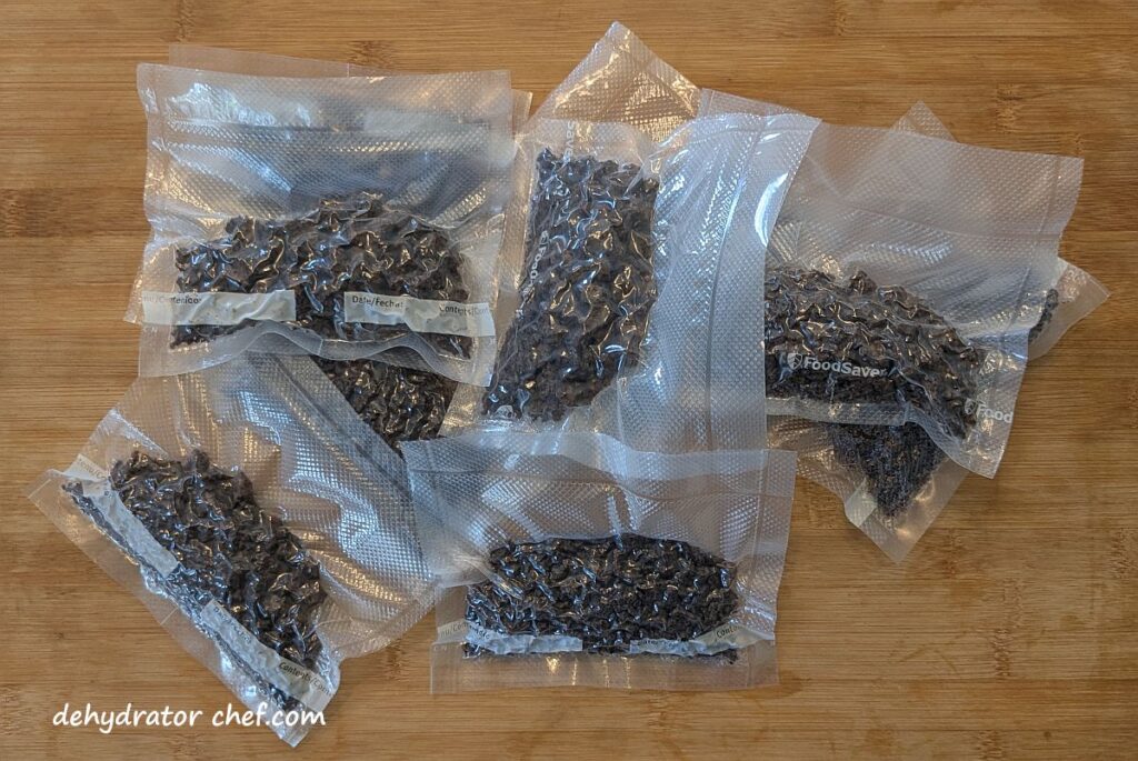 Shown is a stash of single-serving dehydrated ground beef packets that we will freeze for future use. We portioned out the dehydrated ground beef crumbles into 50 gram single-serving vacuumed-sealed packets. Next, we’ll put them all into a large pouch and then vacuum seal. Finally, it all goes into the freezer and ready for future use.