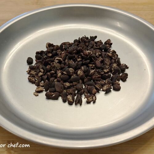Dehydrated canned black beans on a plate, ready for long-term storage and use in homemade backpacking meals.