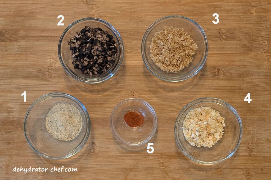 The dry mix ingredients for the dehydrated black beans and rice are arranged on a cutting board.