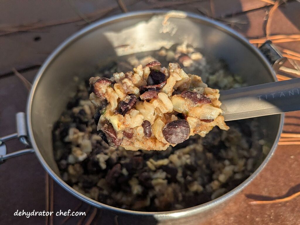 The black beans and rice have finished cooking and steaming to hydrate. We fluffed up the mix and added a bit of optional avocado oil to enhance the flavor a bit. We’re eating good tonight!